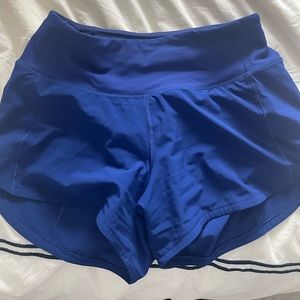 BRIGHT BLUE LULULEMON SPEED UPS. Size 2, 4 inch, mid rise.